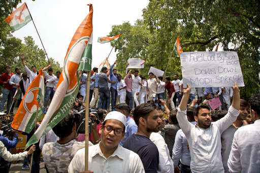 Youth Congress party workers protest a hike in fuel prices in New Delhi, India.