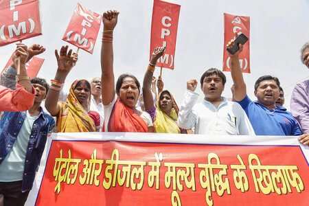 CPI-M activists raise slogans during a protest against petrol and diesel price hike.