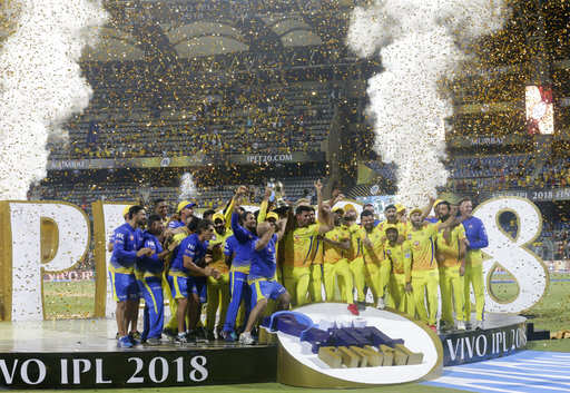 RESENDING WITH CAPTION CORRECTION, Members of Chennai Super Kings pose with trophy after wining against Sunrisers Hyderabad's at VIVO IPL cricket T20 final match in Mumbai, India, Sunday, May 27, 2018 .Photo/Rafiq Maqbool)