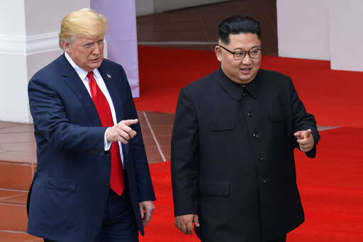 U.S. President Donald Trump and North Korea leader Kim Jong Un walk from lunch at the Capella resort on Sentosa Island Tuesday, June 12, 2018 in Singapore.Photo/Susan Walsh, Pool)