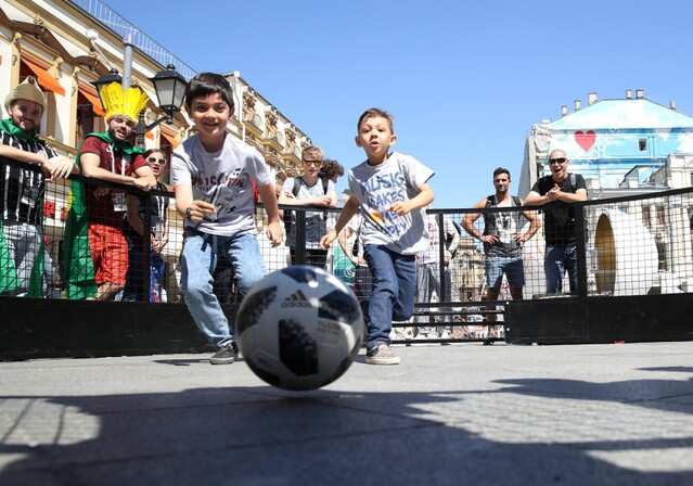 Soccer Football - World Cup - Moscow, Russia - June 15, 2018 Children play football at a fan park in Moscow REUTERS/Carl Recine