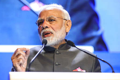 India's Prime Minister Narendra Modi delivers a keynote address at the opening dinner of the 17th IISS Shangri-la Dialogue, an annual defense and security forum in Asia, held in Singapore, Friday, June 1, 2018, in Singapore.Photo/Yong Teck Lim)