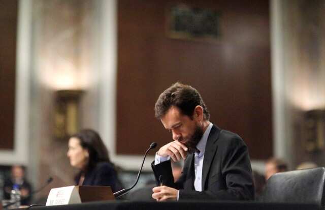 Twitter CEO Jack Dorsey takes notes as he testifies with Facebook COO Sheryl Sandberg at a Senate Intelligence Committee hearing on foreign influence operations on social media platforms on Capitol Hill in Washington, U.S., September 5, 2018. REUTERS/Jim Bourg