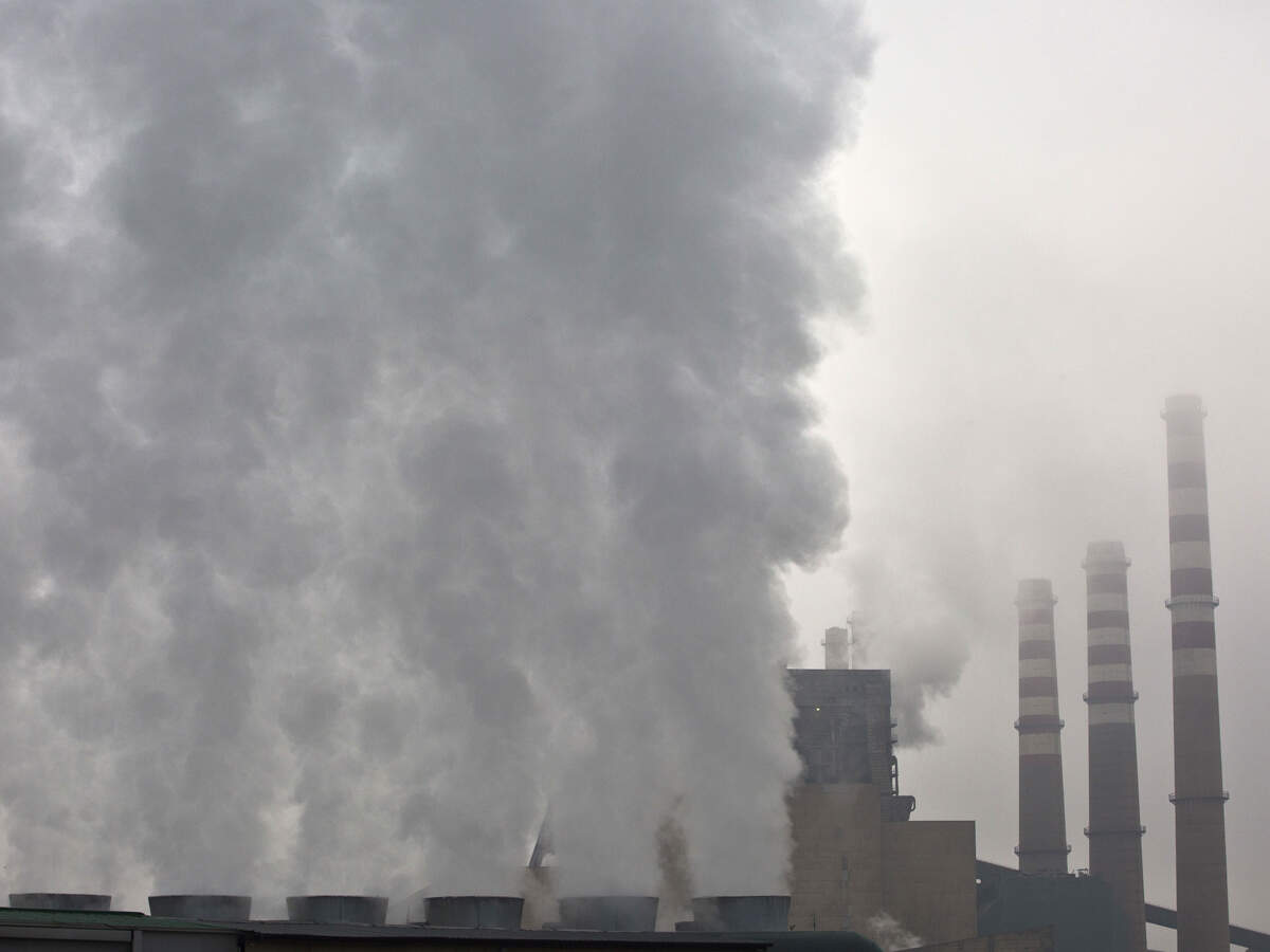 Air pollution lowering day temperatures during rains