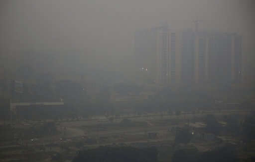 Morning haze envelops the skyline on the outskirts of New Delhi, India, Tuesday, Oct. 30, 2018. 