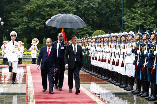 Russian Prime Minister Dmitry Medvedev, center right, and his Vietnamese counterpart Nguyen Xuan Phuc 