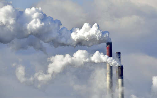 Greenpeace activists climb Poland's biggest power plant in coal protest