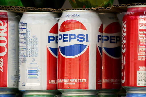 FILE- In this May 7, 2018, file photo, cans of Pepsi are displayed in New York. PepsiCo Inc. reports earns on Tuesday, Oct. 2.Photo/Mark Lennihan, File)