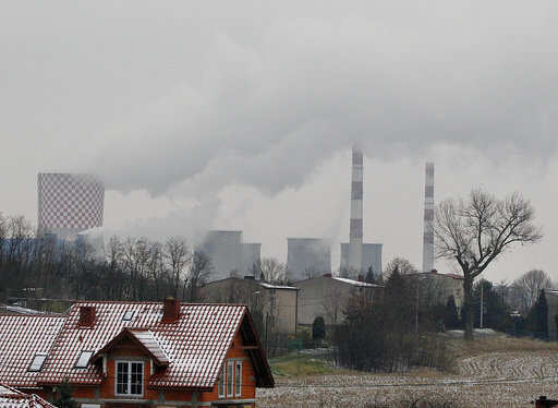 Smoke billows from chimney stacks of the heating and power plant in Bedzin, near Katowice, southern Poland. Katowice, in the southern coal mining region, is hosting global climate summit Dec.2-14.