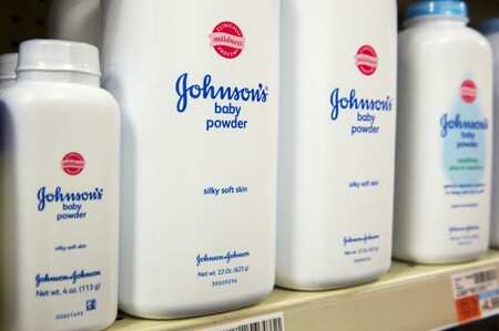 Bottles of Johnson & Johnson baby powder line a drugstore shelf in New York October 15, 2015. REUTERS/Lucas Jackson/File Photo