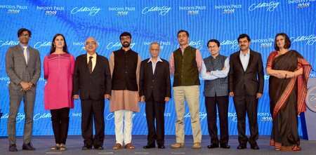 Winnners of &quot;Infosys Prize 2018&quot; of Infosys Science Foundation, pose with Infosys co-founder Narayana Murthy (C) and Mathamatician Manjul Bhargava (4th from L) during the award ceremoney in Bengaluru.