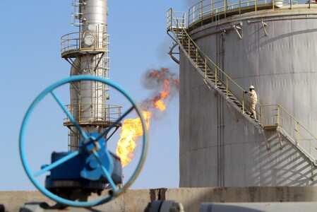 A worker climbs stairs at the Halfaya oilfield in Amara, southeast of Baghdad, January 21, 2016. REUTERS/Essam Al-Sudani/Files