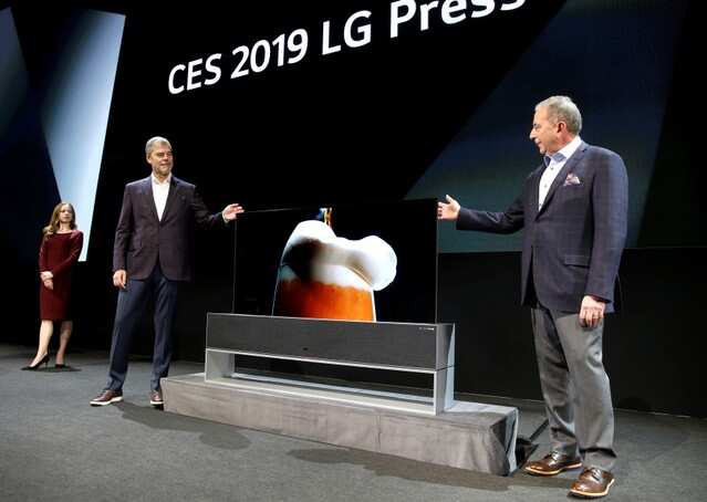 David Vanderwaal (L), senior vice president of marketing for LG Electronics USA, and Tim Alessi, senior director of home entertainment products for LG Electronics USA, stand by an LG Signature OLED TV R a television with a rollable screen that can be retracted into its base, during an LG Electronics news conference at the 2019 CES in Las Vegas, Nevada, U.S. January 7, 2019. REUTERS/Steve Marcus
