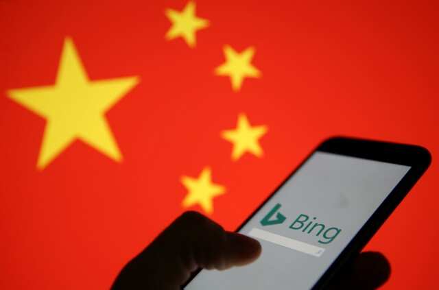A smartphone with the Microsoft Bing logo is displayed against the backdrop of a Chinese flag in this picture illustration taken January 24, 2019. REUTERS/Dado Ruvic/Illustration