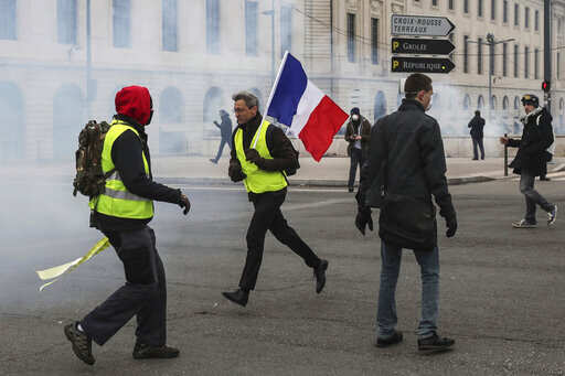 'Yellow vests' back on France's streets to challenge Macron