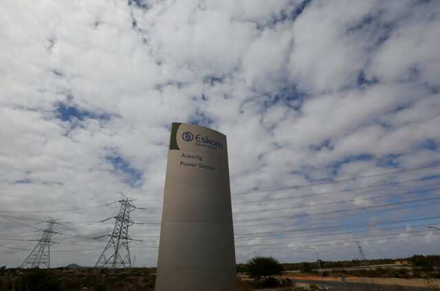 Pylons carry electricity from a sub-station of state power utility Eskom outside Cape Town in this picture. REUTERS