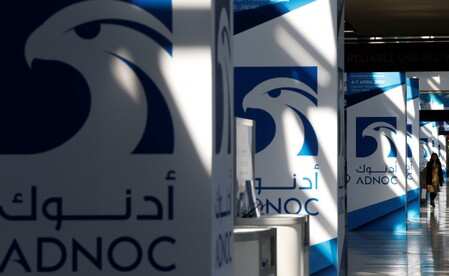 Logos of ADNOC are seen at Gastech, the world's biggest expo for the gas industry, in Chiba, Japan, April 4, 2017. REUTERS/Toru Hanai/File Photo