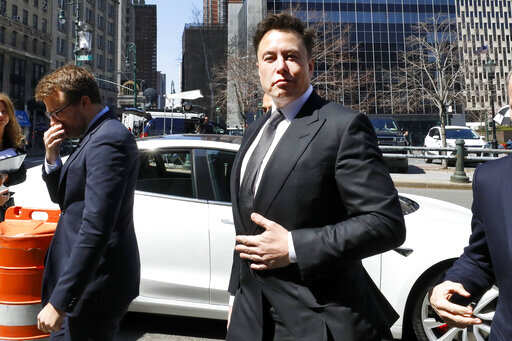 Tesla CEO Elon Musk plans to hand the car keys to robots next year