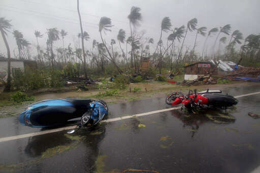 Motorcycles lie on a street in Puri district after Cyclone Fani hit Odisha, Friday, May 3, 2019. 