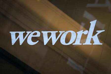 The WeWork logo is displayed on the entrance of a co-working space in New York City, New York U.S., January 8, 2019. REUTERS/Brendan McDermid/File Photo