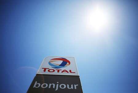 The logo of French oil and gas company Total is seen above a petrol station in Cape Town, South Africa February 7, 2019. REUTERS/Mike Hutchings/File Photo