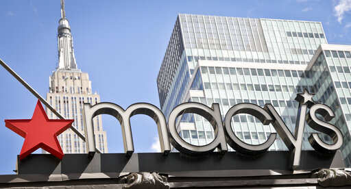 FILE- This May 2, 2017, file photo shows corporate signage at Macy's flagship store in New York. Macy's Inc. reports financial results Wednesday, May 15, 2019.Photo/Bebeto Matthews, File)