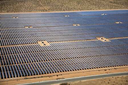 An array of solar panels is seen in the desert near Victorville, California, U.S. March 28, 2018. REUTERS/Lucy Nicholson/File Photo