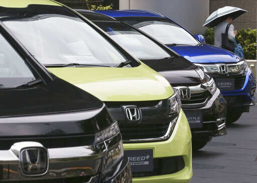 In this July 31, 2019, photo, Honda cars are displayed at the automaker's headquarters in Tokyo. Japanese automaker Honda reported Friday, Aug. 2, a 29% decline in fiscal first quarter profit as an unfavorable currency exchange and declining auto sales in the U.S. and India hurt earnings.Photo/Koji Sasahara)