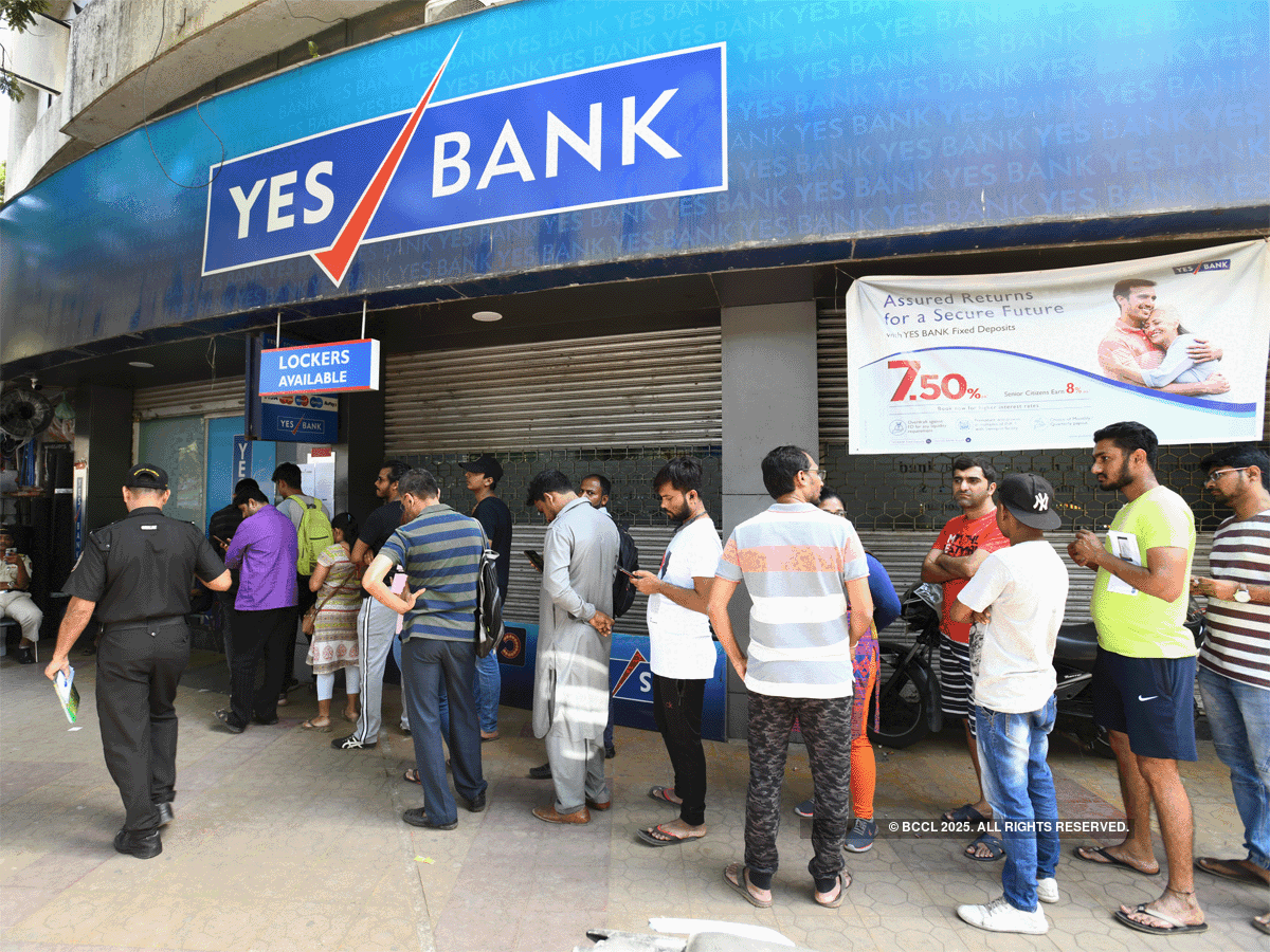 Yes Bank customers queue up to withdraw money when the bank was put under moratorium by the regulator
