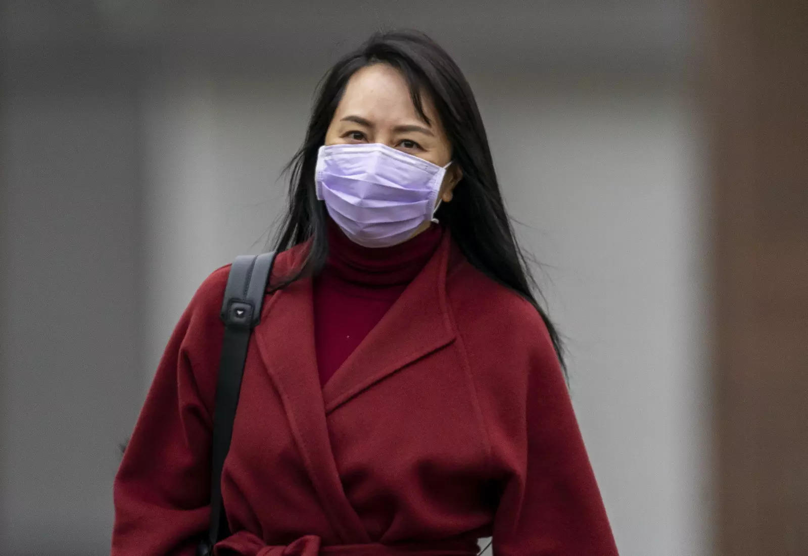 Chief Financial Officer of Huawei Meng Wanzhou leaves her home in Vancouver, Thursday, March 18, 2021. (Jonathan Hayward/The Canadian Press via AP)