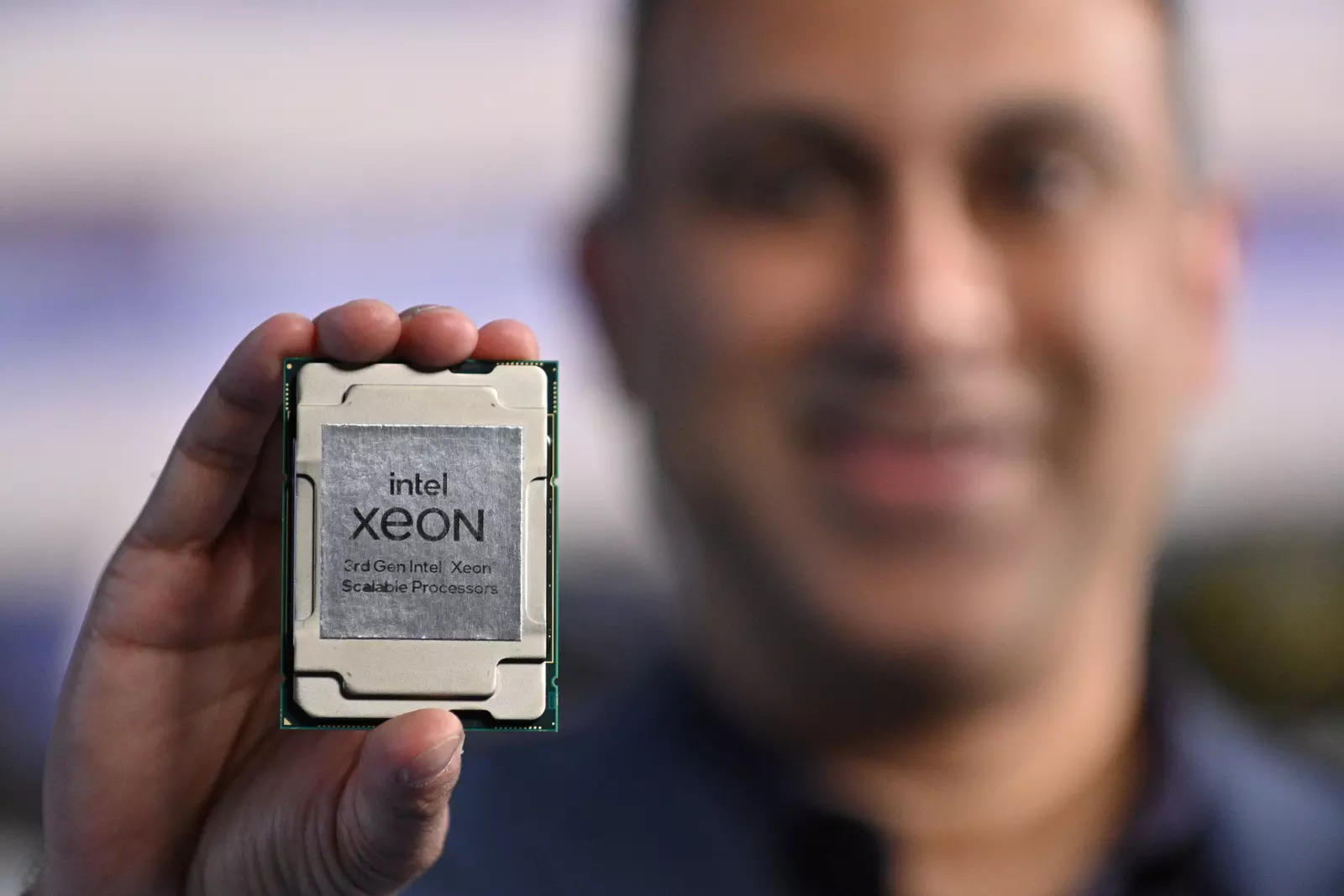 Navin Shenoy, executive vice president and general manager of the data platforms group at Intel Corp, holds one of the company's "Ice Lake" data center chips in an undated handout photo released on April 6, 2021. 