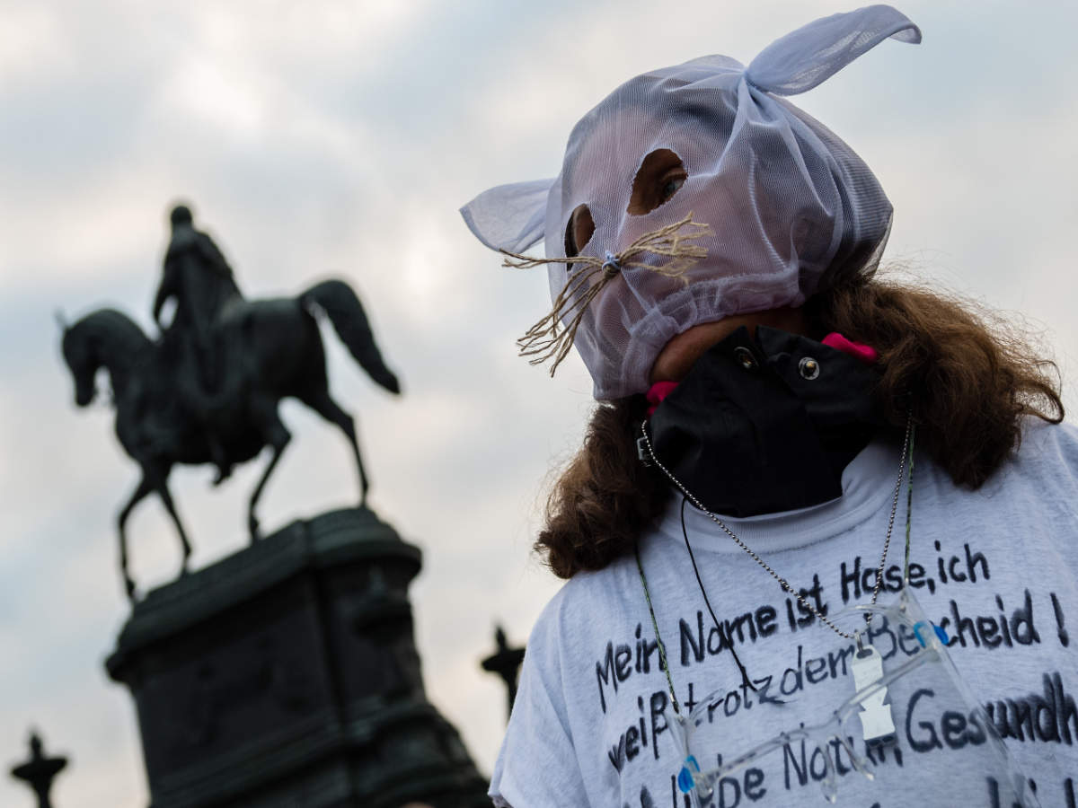 A woman dressed as a rabbit takes part in a rally by the initiative 'Querdenken 351' to protest against the current measures to curb the spread of the novel coronavirus in Dresden, eastern Germany (AFP)
