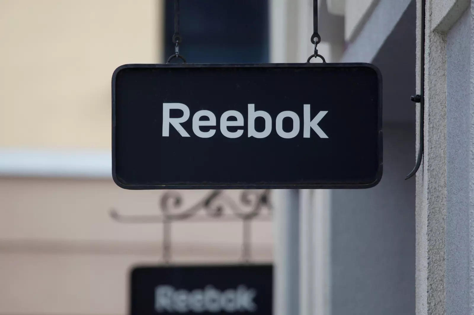 Adidas launches Reebok auction, China row may dent Asian interest