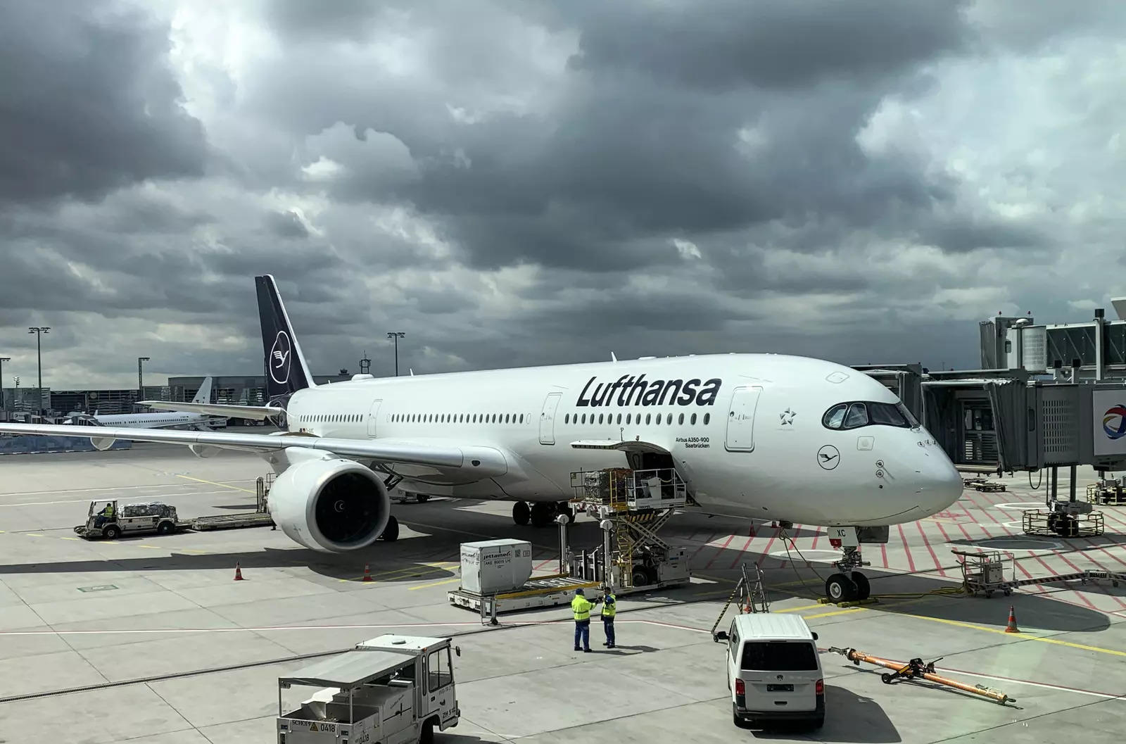 <p>A Lufthansa jet is loaded at the airport in Frankfurt, Germany</p>
