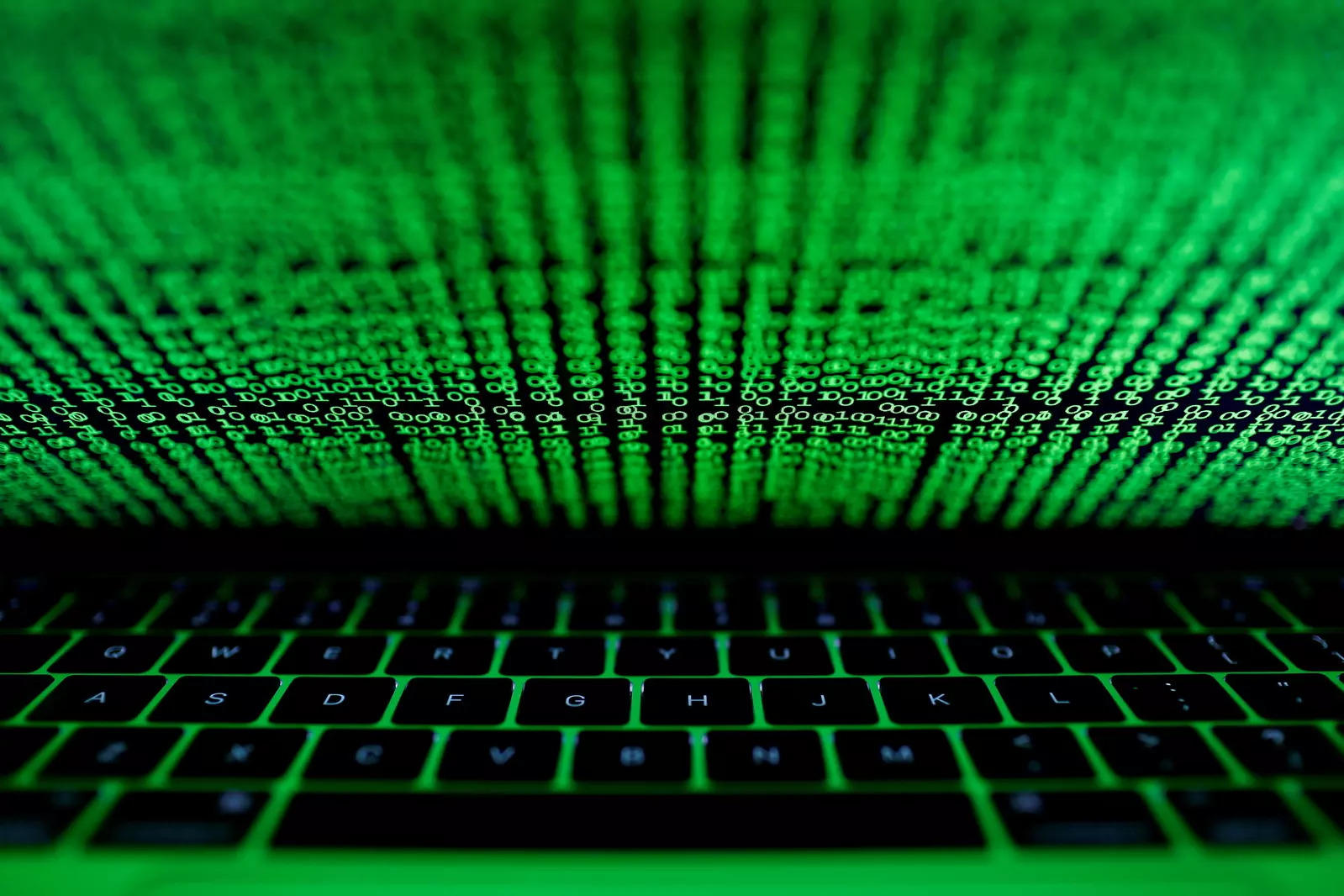 FILE PHOTO: A computer keyboard lit by a displayed cyber code is seen in this illustration picture taken on March 1,  2017. REUTERS/Kacper Pempel/File Photo
