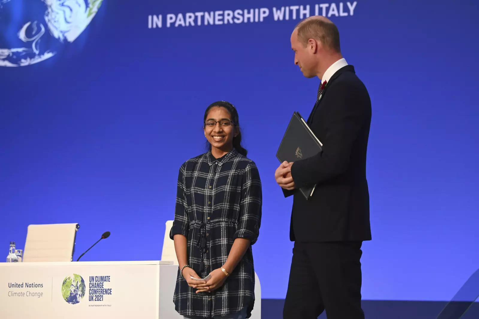Britain's Prince William stands by Earthshot Prize finalist Vinisha Umashankar during the World Leaders' Summit &quot;Accelerating Clean Technology Innovation and Deployment&quot;, at the COP26 Summit, in Glasgow, Scotland, Tuesday, Nov. 2, 2021. The U.N. climate summit in Glasgow gathers leaders from around the world, in Scotland's biggest city, to lay out their vision for addressing the common challenge of global warming. (Jeff J Mitchell/Pool Photo via AP)