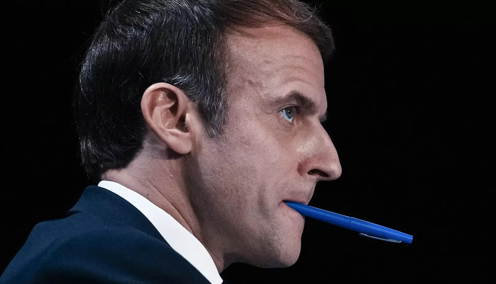 Paris : French President Emmanuel Macron attends the AMF congress with a writing pen in his mouth during the annual meeting of French mayors in Paris. AP/PTI(
