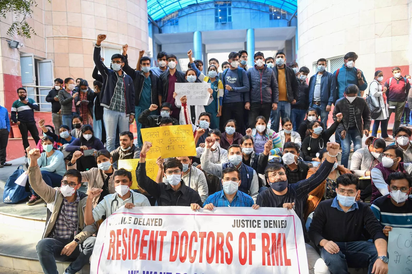New Delhi: Resident doctors of Ram Manohar Lohia Hospital raise slogans during a protest  in New Delhi. (PTI Photo/Ravi Choudhary)(