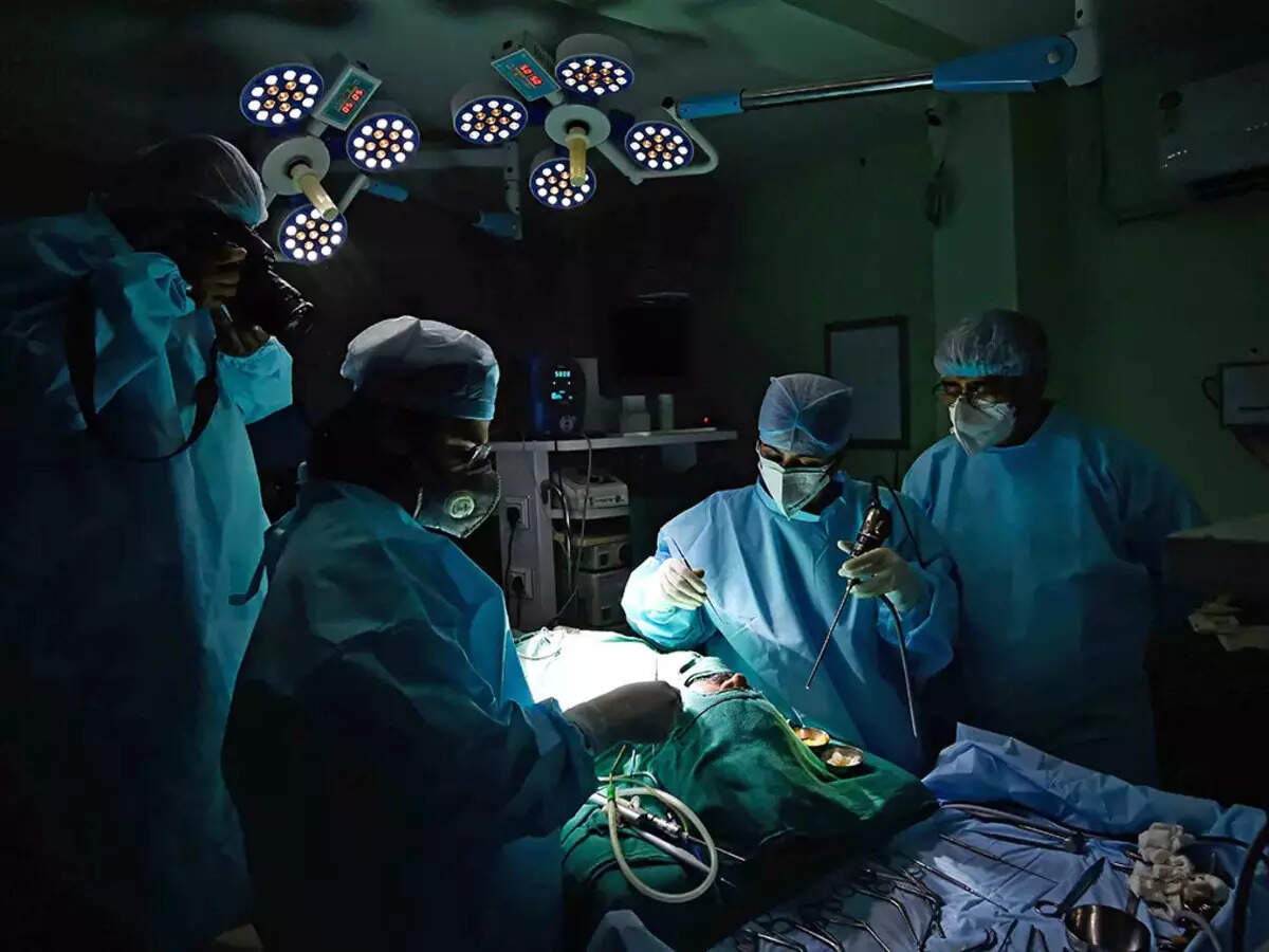 Photo of an operating room with surgeons.