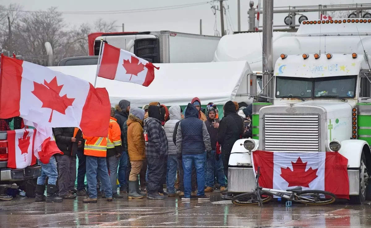  While the number of protesters and police dropped as the night progressed, demonstrators continued to block the bridge with trucks and pick-up vans, preventing any flow of traffic in either direction.