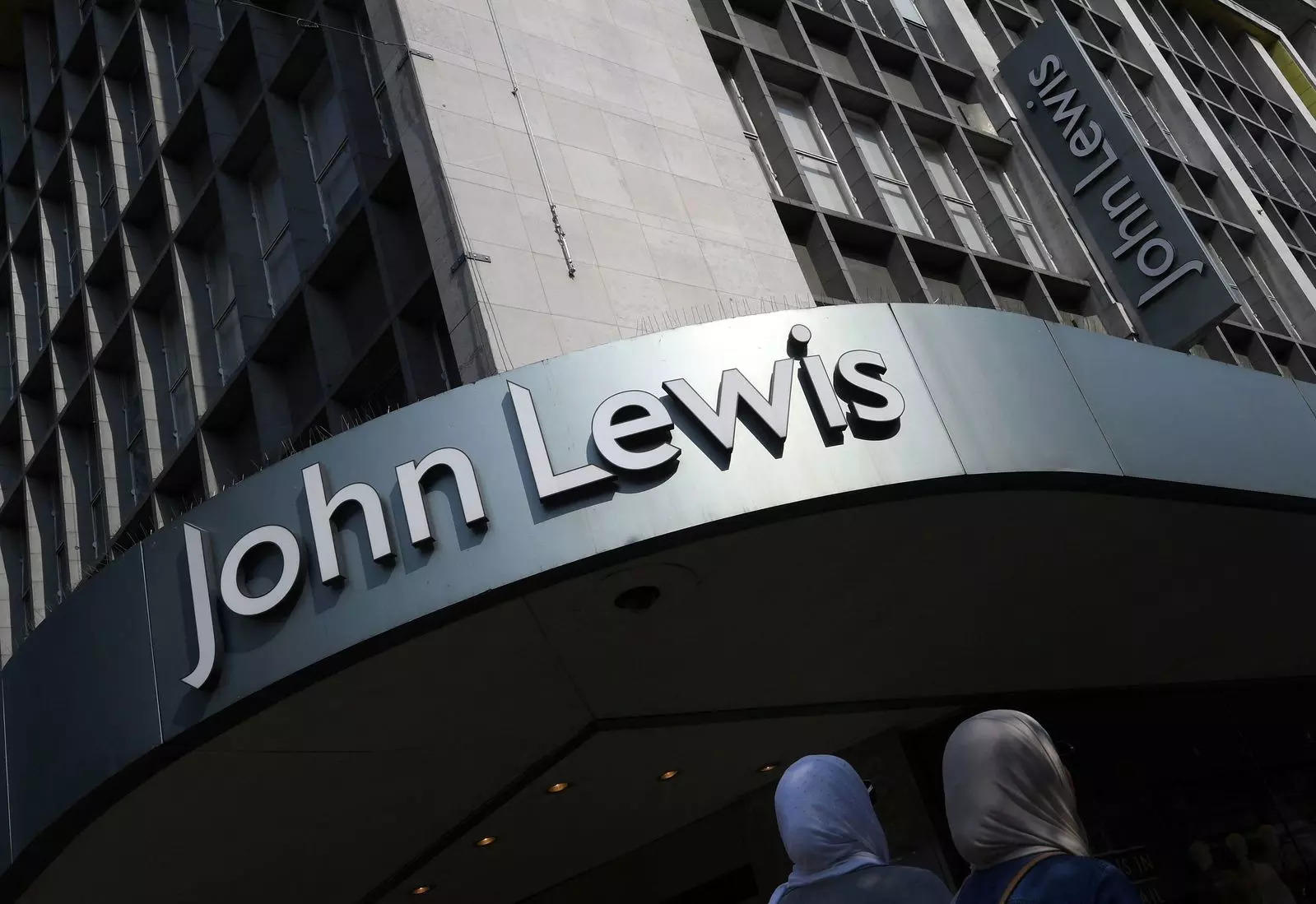 Britain's John Lewis cuts losses and restores staff bonus