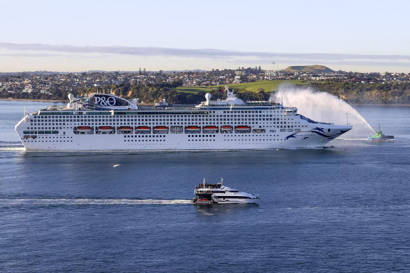  The Pacific Explorer sails into the Waitemata Harbour, in Auckland, New Zealand, Friday, Aug. 12, 2022. New Zealand has welcomed the first cruise ship to return since the coronavirus pandemic began, signaling a long-sought return to normalcy for the nation's tourism industry. (Brett Phibbs/New Zealand Herald)