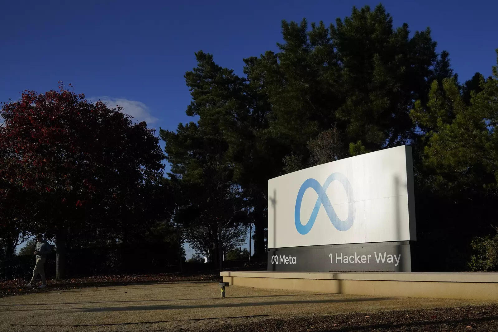  Meta's logo can be seen on a sign at the company's headquarters in Menlo Park, Calif., Wednesday, Nov. 9, 2022. Facebook’s parent Meta will slash another 10,000 jobs and will not fill 5,000 open positions as the social media pioneer cuts costs. The company said Tuesday, March 14, 2023 it will reduce the size of its recruiting team and then further cuts in its tech groups in late April, and then its business groups in late May. (AP Photo/Godofredo A. Vásquez)
