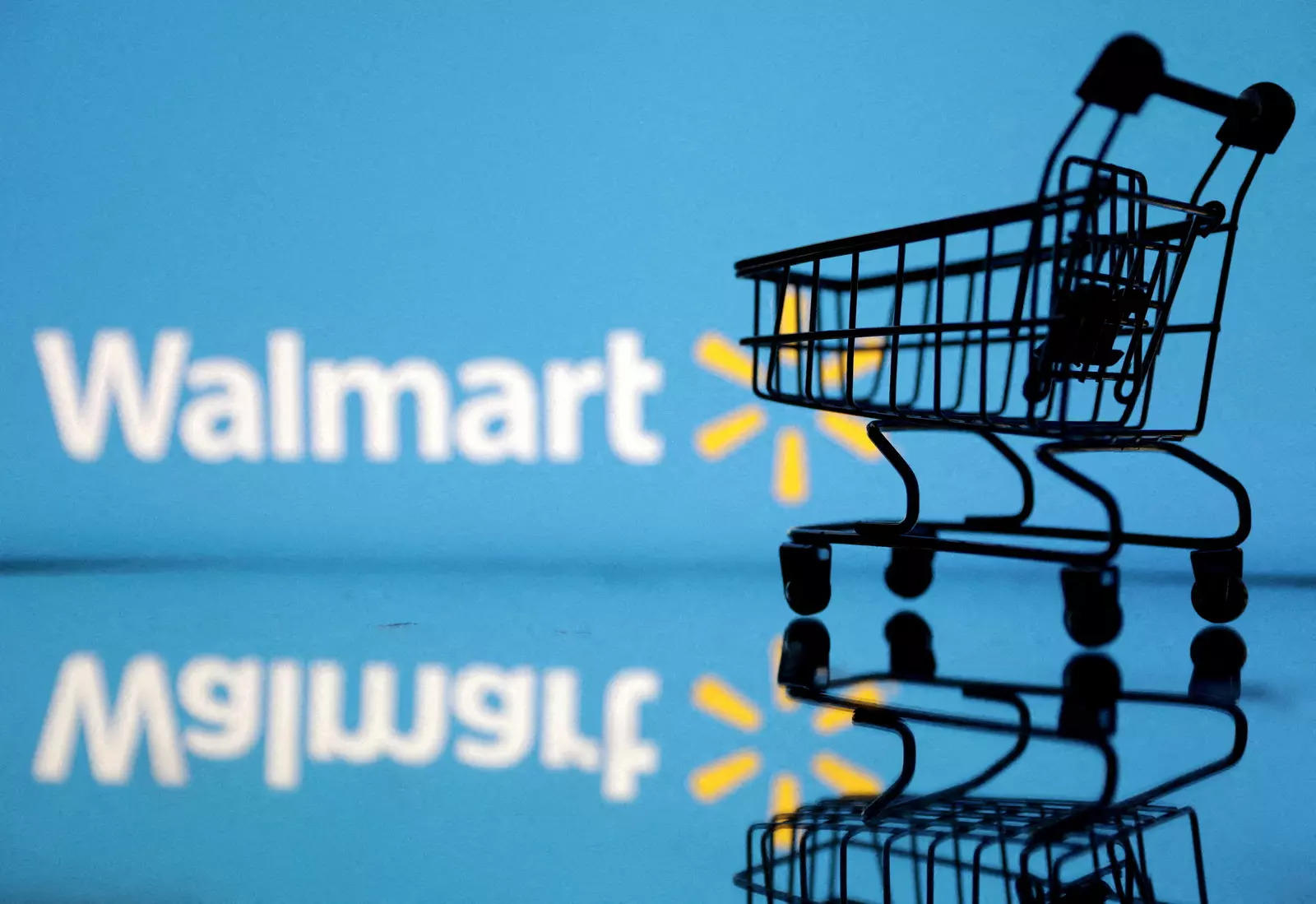     FILE PHOTO: This image shows a shopping cart in front of the Walmart logo, July 24, 2022. REUTERS/Dado Ruvic/Illustration