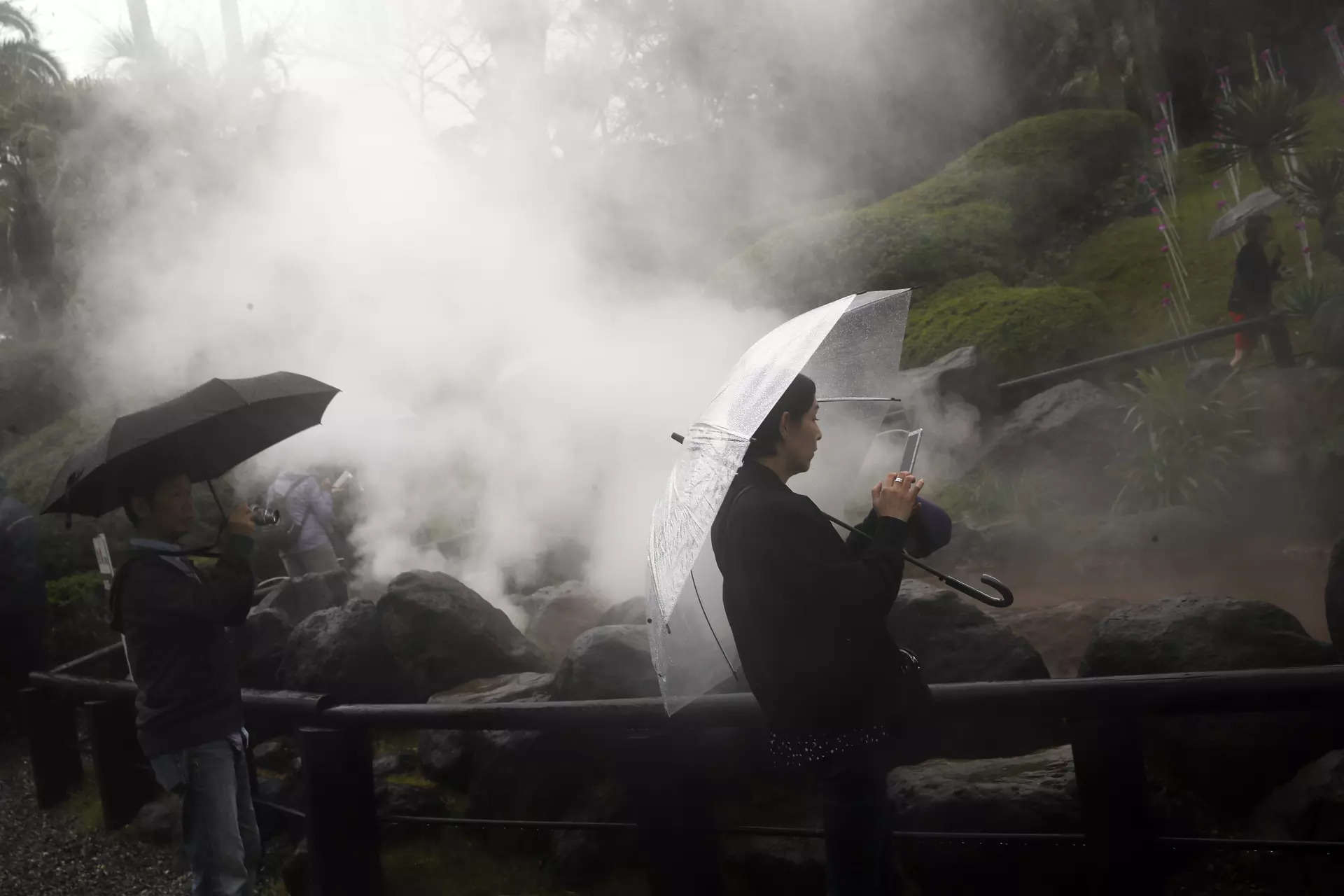 <p>FILE - Visitors take photos as they visit the hot springs in Beppu, Japan Oct. 17, 2019. Japan and the United States agreed Saturday, April 15, 2023 to cooperate on developing geothermal energy, one of the most plentiful resources on this volcanic island chain. (AP Photo/Christophe Ena, File)</p>