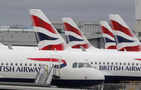 British Airways owner slashes loss on strong demand